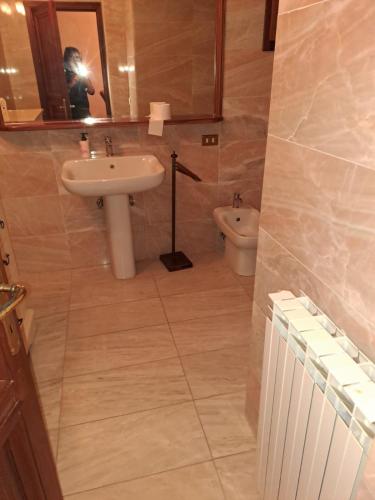 a bathroom with a sink and a toilet at Frontemare in Porto Santo Stefano