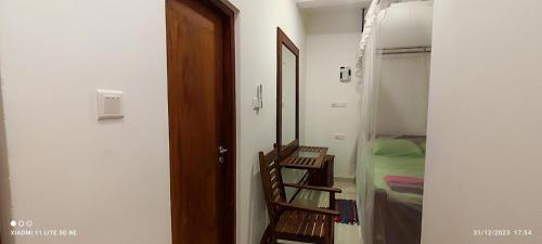 a room with a hallway with a door and a bedroom at Villa Tanzanite Hikkaduwa in Hikkaduwa