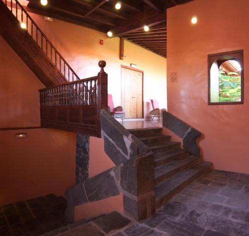 a stairway in a building with a stair case at Hotel LIVVO La Quinta Roja in Garachico