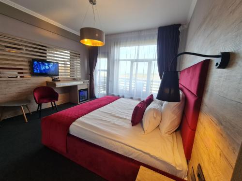 Ένα ή περισσότερα κρεβάτια σε δωμάτιο στο Boutique Hotel Cattaleya