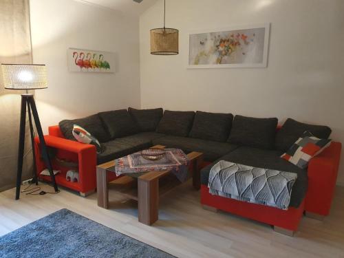 a living room with a couch and a table at Haus Sonntal in Bodenmais