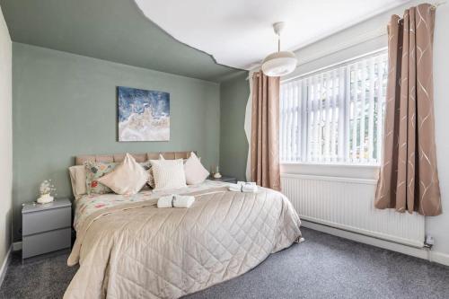 a bedroom with a bed and a window at Space House in Sheffield