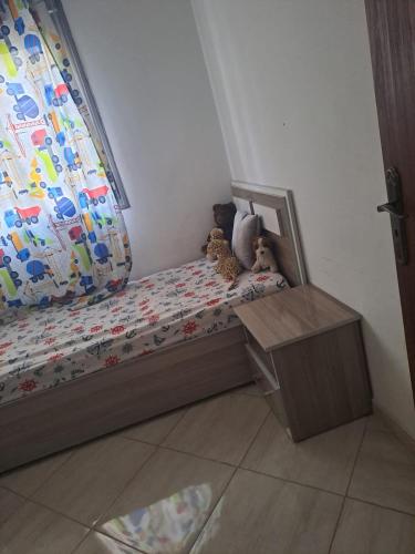 a childs bed with two stuffed animals sitting on it at Medhouse in Mohammedia