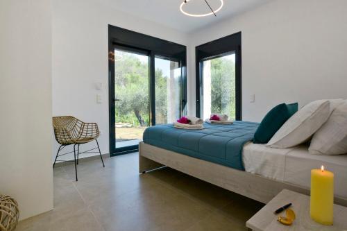 Postel nebo postele na pokoji v ubytování Villa Kalloni