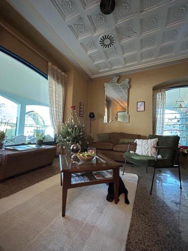 a living room with a couch and a table at Hotel Risi in Colico