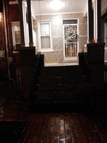a building with stairs and a window in the dark at MJD Havens in Washington