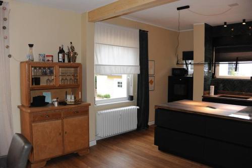 a kitchen with a counter and a window at Luxuriöse Wohnung in Schwerte in Schwerte