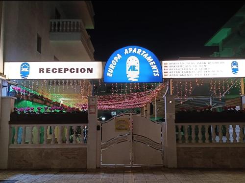 a sign for a store with christmas lights at Europa Family Apartments in Blanes