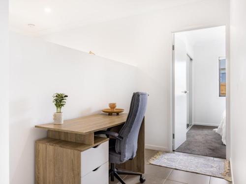 an office with a desk and a chair at 4BR Newly furnished Cozy house Brownsplain in Browns Plains