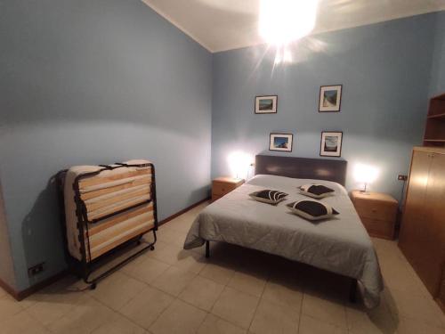 a bedroom with a bed with two pillows on it at Casa Zia Luisa in Lecco