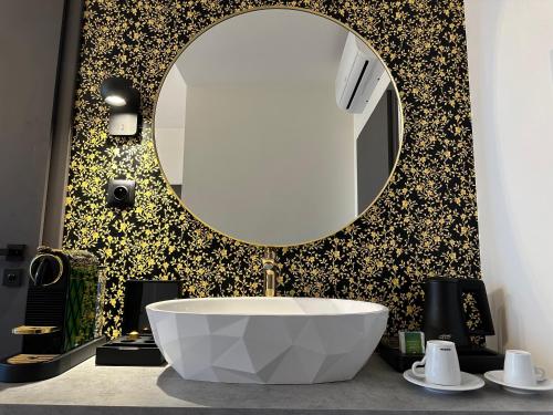 a bathroom with a large mirror and a tub at Villa Mala Praha Experience in the Center of Žilina in Žilina