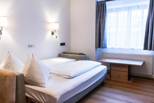 Cama o camas de una habitación en Pension Appartements Alpenblick