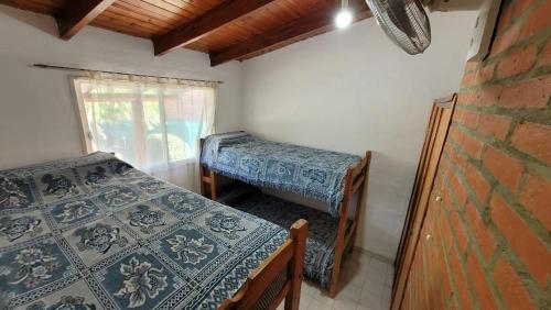 En eller flere senge i et værelse på Mi Recreo CABAÑAS