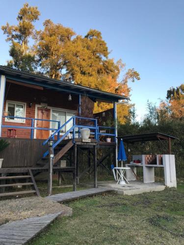 a house with a large deck and a porch at Itaca delta cabañas in Tigre