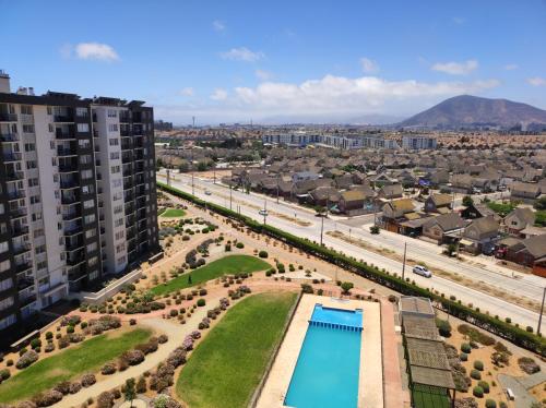an aerial view of a city with a swimming pool at Hermoso departamento in Coquimbo