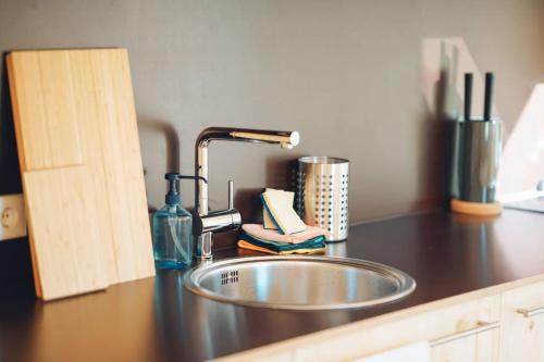 a kitchen counter with a sink in a kitchen at Gonner Haus 