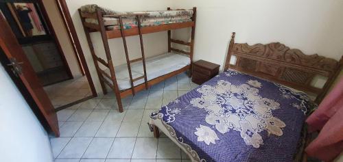 Säng eller sängar i ett rum på Casa Temporada Guriri Beach