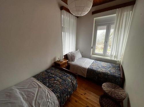 Ένα ή περισσότερα κρεβάτια σε δωμάτιο στο Chalet Karpenisi