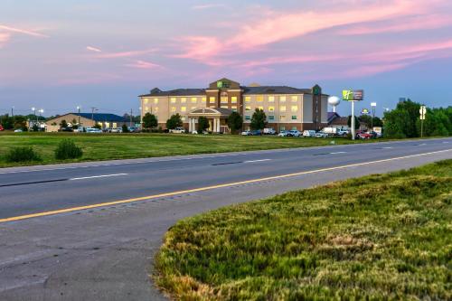 an empty road in front of a large building at Holiday Inn Express Hotel & Suites Salina by IHG in Salina