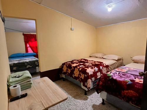 Cama o camas de una habitación en Hotel Canaan La aurora