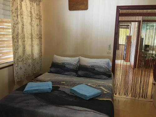 Säng eller sängar i ett rum på Iaora BoraBora House PUHIA