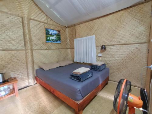 Un ou plusieurs lits dans un hébergement de l'établissement Imsuk Bo Klua