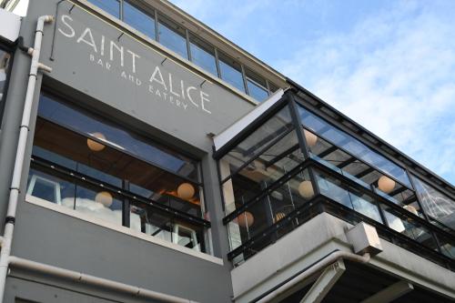 a building with a sign on the side of it at Luxurious & Spacious Living with Breathtaking Views in Auckland