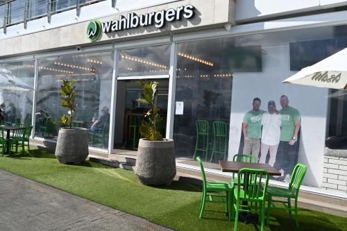 a group of people standing in a store window at Luxurious & Spacious Living with Breathtaking Views in Auckland