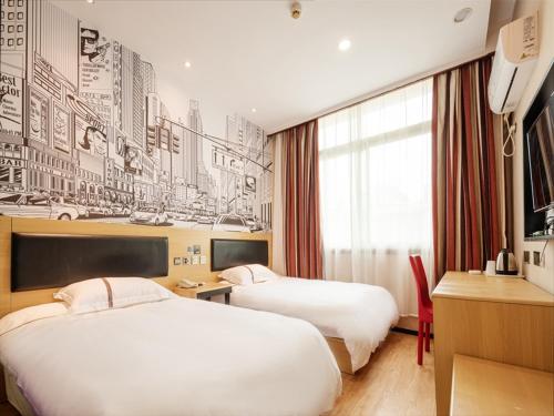 a hotel room with two beds and a wall mural at Thank Inn Chain Hotel jiangxi nanchang west lake district August 1st plaza in Nanchang