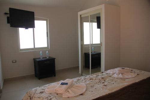 Ένα ή περισσότερα κρεβάτια σε δωμάτιο στο Rolovi Hotel Xalapa Centro