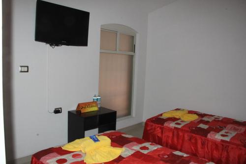 Ένα ή περισσότερα κρεβάτια σε δωμάτιο στο Rolovi Hotel Xalapa Centro