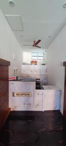 a room with aption box in the middle of a room at Hotel Rays Inn and Pegs Family Restaurant in Dharmastala