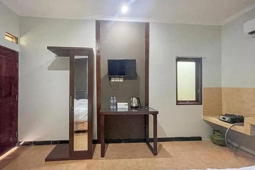 Koupelna v ubytování Villa Kampoeng City Wonosalam Mitra RedDoorz