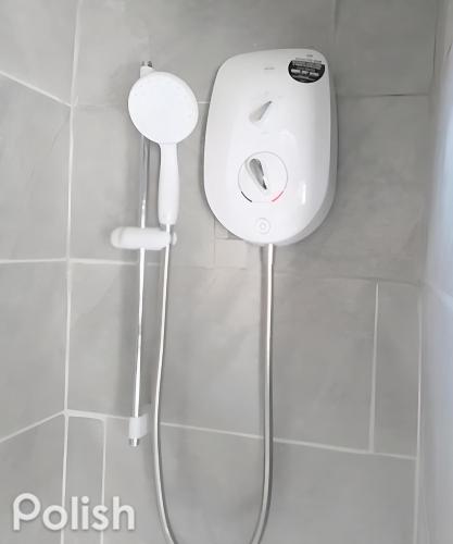 a shower in a bathroom with a roll up shower at Tsalach Short Lets in Nottingham