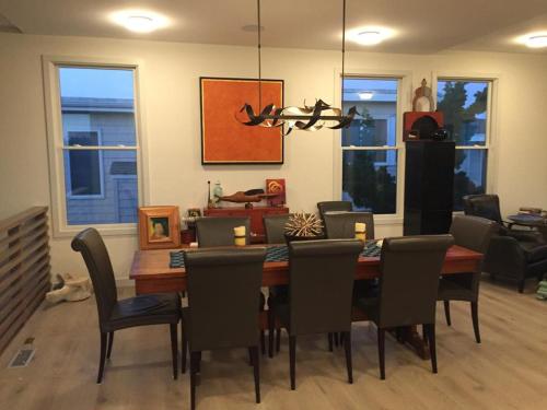 a dining room with a table and chairs at Van Zandt 1976 in Waretown