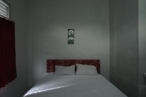 Ένα ή περισσότερα κρεβάτια σε δωμάτιο στο Hotel O Guest House Zidan 21