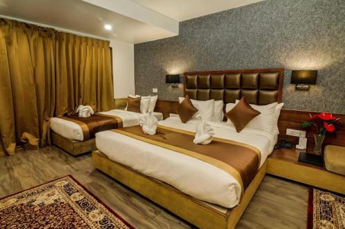 a hotel room with two beds in a room at Taarra view green with parking in Gangtok