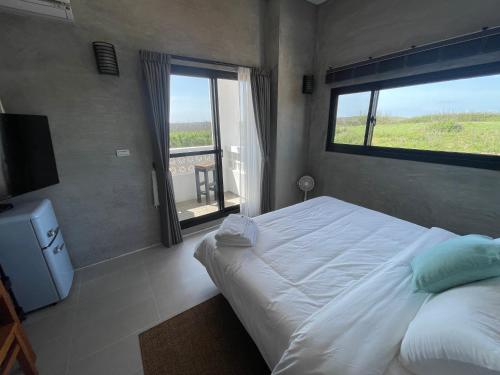 Postel nebo postele na pokoji v ubytování Serendipity House澎湖望安島