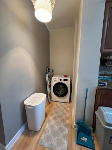 a laundry room with a washing machine in it at Spacious 2 BR in heart of the city in Ulaanbaatar