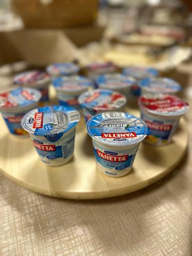 a tray of cups of yogurt on a table at Hotel Morolli in Rimini