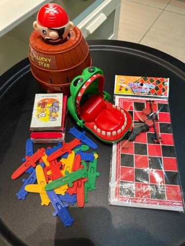 a table topped with toys on top of a table at Manhattan Austin 2-6 pax Family Cozy Suite in Johor Bahru