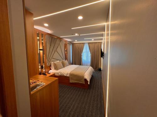 a bedroom with a bed and a door leading into a room at istanbul vipinnhotels in Istanbul