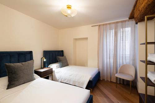 Letto o letti in una camera di The Seven Residence