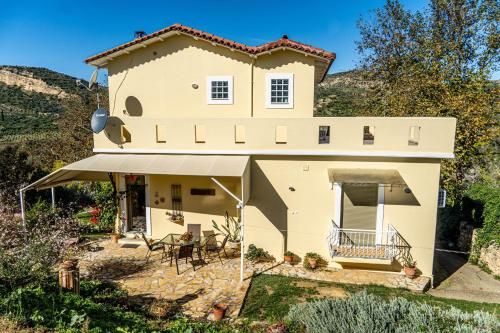 a villa with a view of the house at Estia guest house in Olympia
