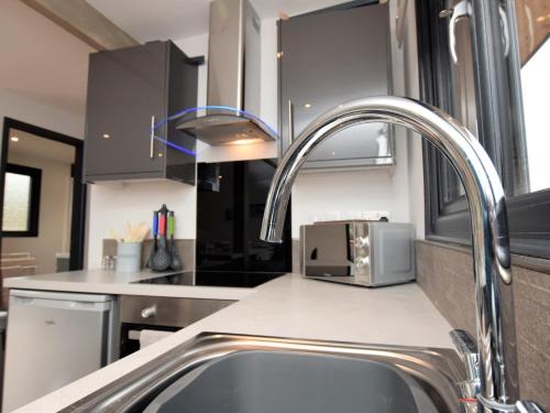 a kitchen with a sink and a microwave at 2 Bed in Thetford 73624 in East Harling