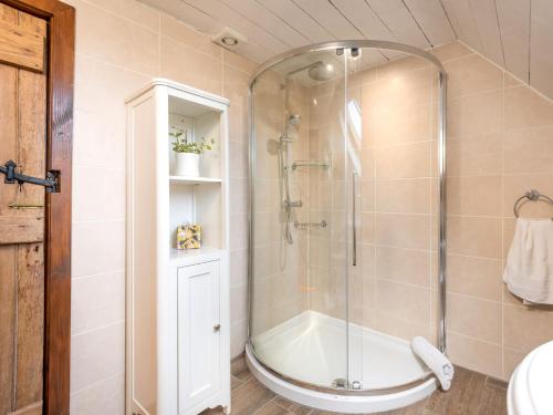 a bathroom with a shower with a glass shower stall at 2 bed in Loch Ness CA315 in Drumnadrochit
