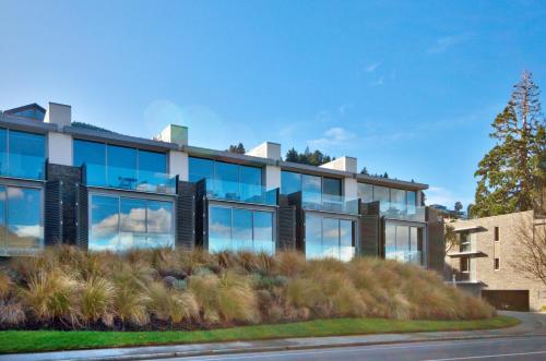 an office building with a lot of windows at Pure Retreat Lake Views P119 in Queenstown