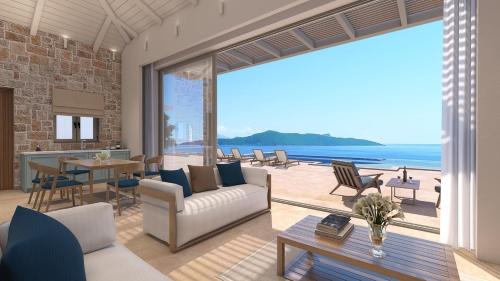Una sala de estar con vista al mar. en Villa Noesis, en Katomérion