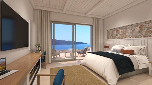Una habitación con cama y vistas al océano. en Villa Noesis, en Katomérion
