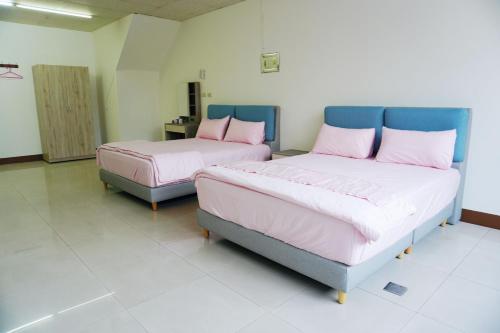 Llit o llits en una habitació de Chuncheng B&B